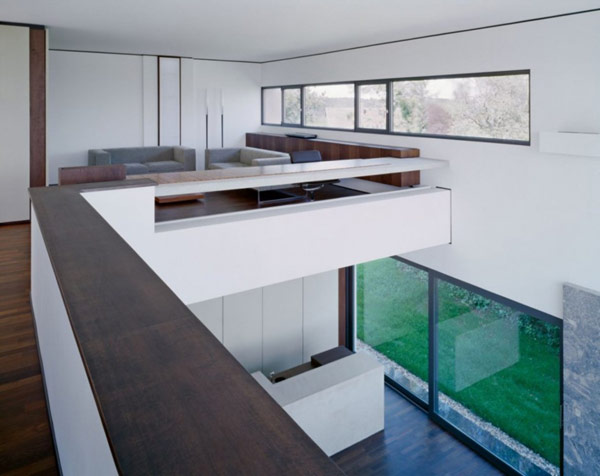 interior-third-floor-workspace-office-sofa-wooden-floor-large-window-green-grass-long-Chest-of-Drawer-glass-door